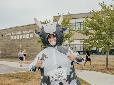 Lindsay Milk Run Runner wearing a cow costume