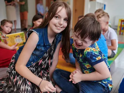 Camp Volunteer enjoying time with her new Inclusion Camper during summer day camps