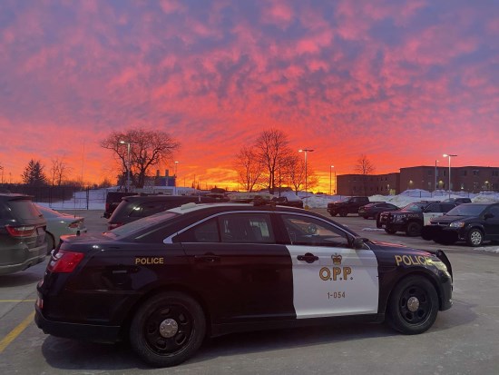 OPP car parked in Kawartha Lakes with a sunset over it