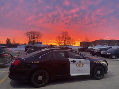 OPP car parked in Kawartha Lakes with a sunset over it