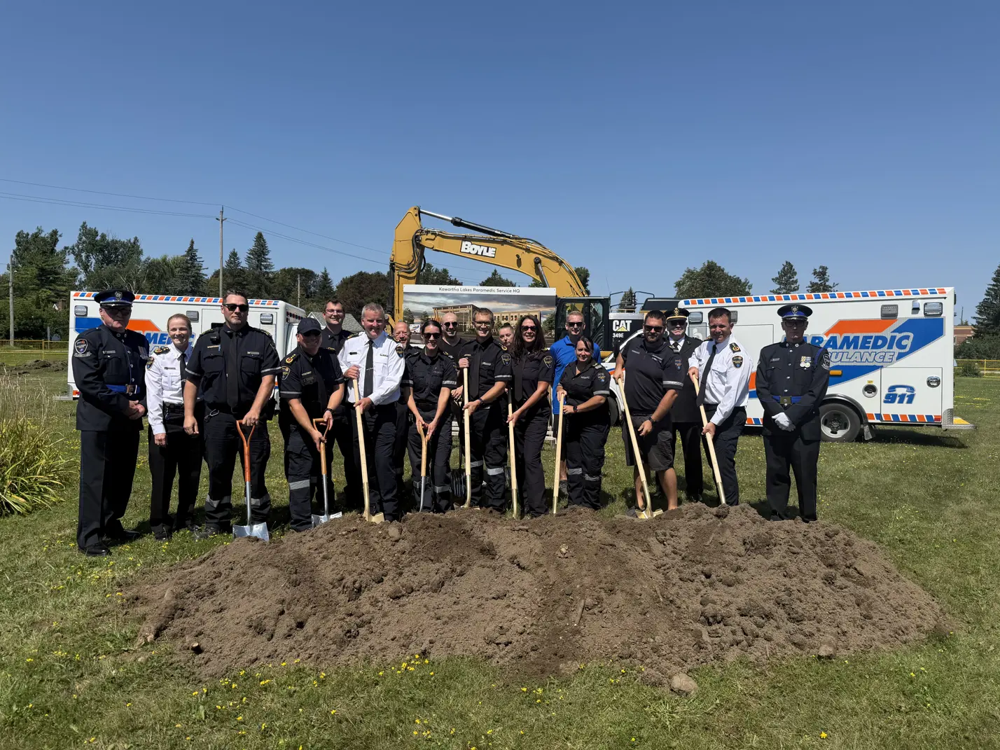 Paramedic HQ groundbreaking ceremony attendees posing with shovels
