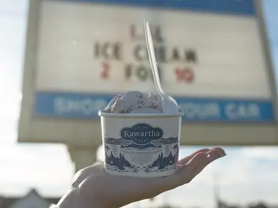 Hand holding cup of Kawartha Dairy ice cream