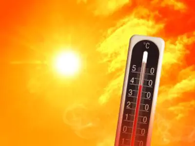 The sun with a thermometer reading 40 degrees celsius in front of it