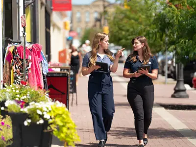Two Economic development students walking down Kent Street.