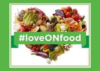A variety of local foods put together to make a heart shape. A text overlay reads "#loveONfood"
