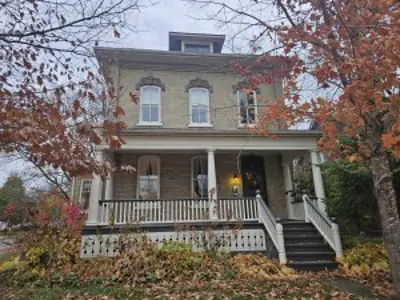 Large historic brick house in the fall