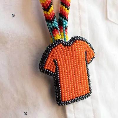 Beaded orange shirt