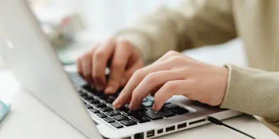 typing on a laptop