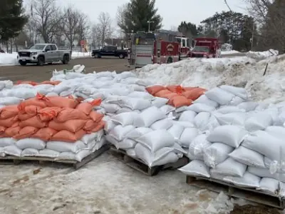 pre-filled sandbags on skids outside of a community centre