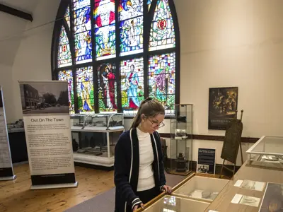 museum interior with large stained glass