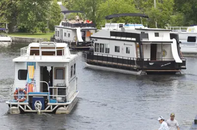 Three boats on a narrow waterway