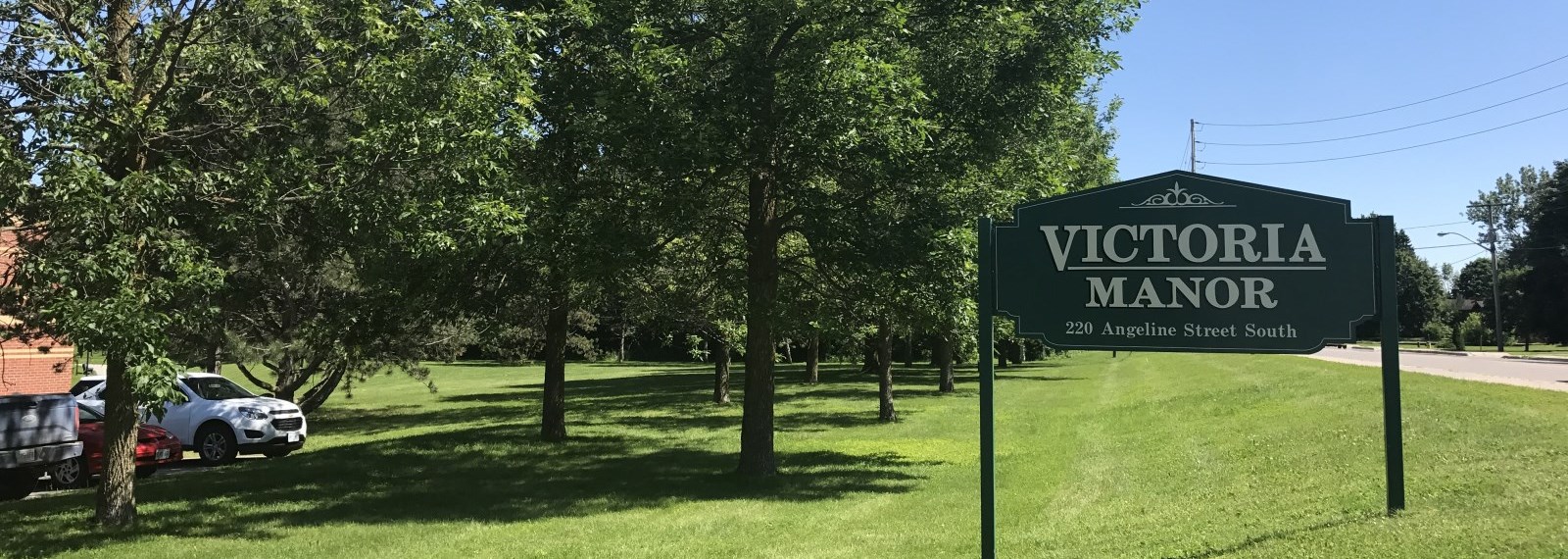Victoria manor sign on green grass