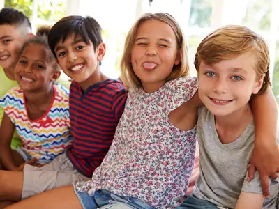 group of kids posing for the camera and having fun