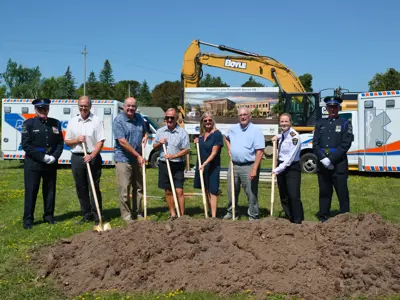 Councillors shoveling at groundbreaking ceremony