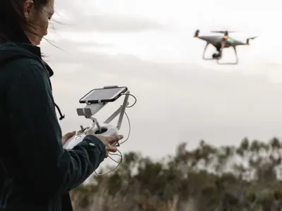 woman flying drone
