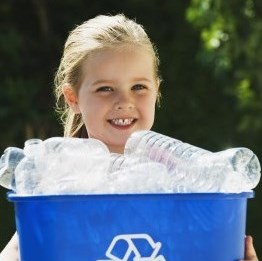 girl holding a blue recycling bin